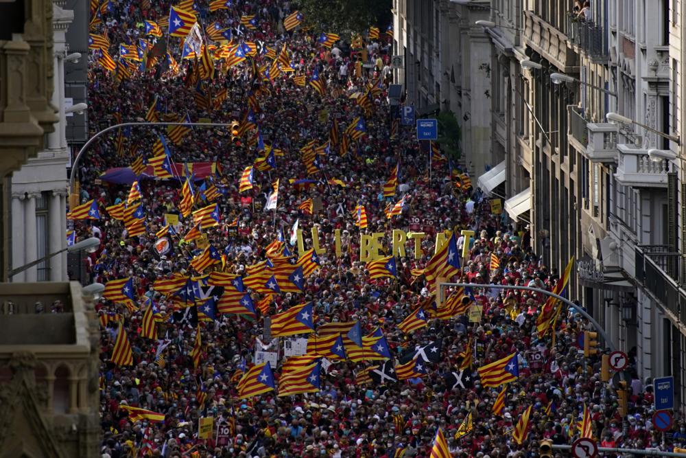 Demonstrators march during the Catalan National Day in Barcelona, Spain, Saturday, Sept. 11, 2021. Thousands of Catalans have rallied for independence from the rest of Spain in their first major mass gathering since the start of the pandemic. The march in Barcelona on Saturday comes before a meeting between regional leaders in northeast Catalonia and the Spanish government. ( AP Photo/Joan Mateu Parra)