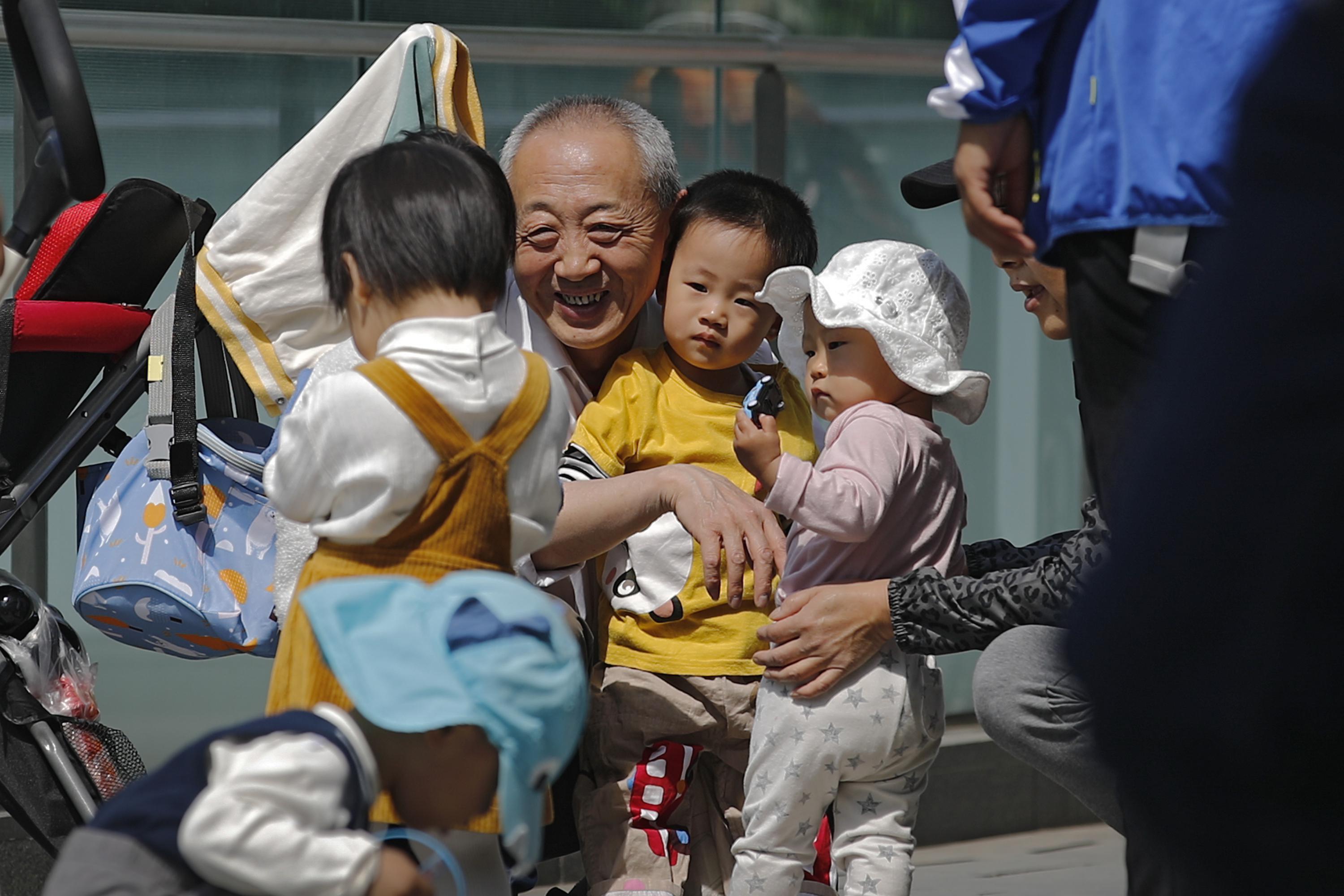 China easing birth limits further to cope with aging society AP News