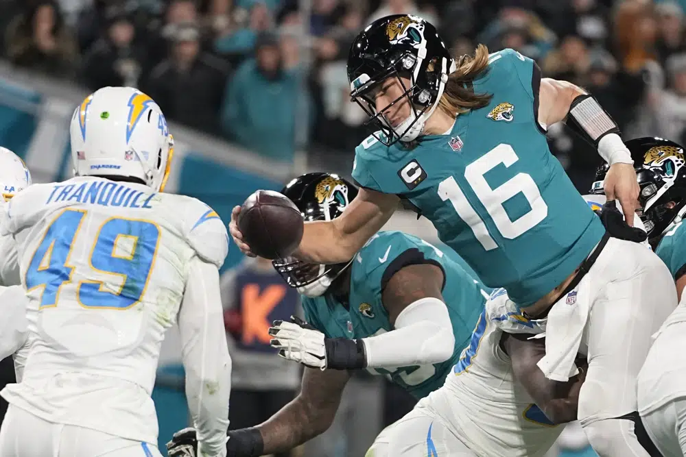 Jacksonville Jaguars quarterback Trevor Lawrence (16) is pressured