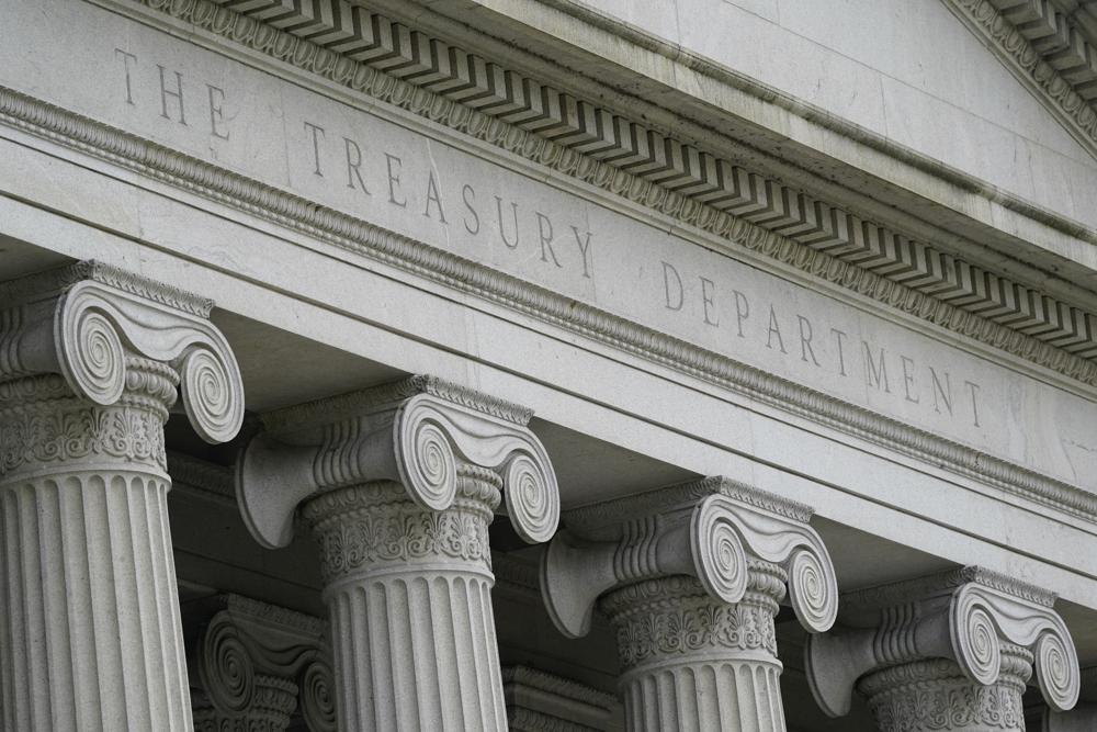 CORRECTS SPELLING OF LAST NAME TO BOWDLER INSTEAD OF BROWDLER - FILE - This May 4, 2021, photo shows the Treasury Building in Washington. On Monday, Oct. 25, 2021, the Treasury Department announced the hiring of Janis Bowdler, a former JPMorgan Chase executive, to head a new government program aimed at combatting racial inequality issues in banking and other financial-services industries. (AP Photo/Patrick Semansky, File)