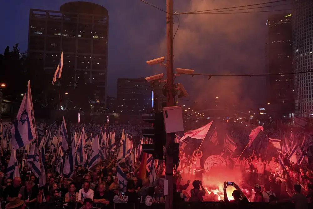 Israelis protest against plans by Prime Minister Benjamin Netanyahu's government to overhaul the judicial system in Tel Aviv, Saturday, May 6, 2023. (AP Photo/Ariel Schalit)