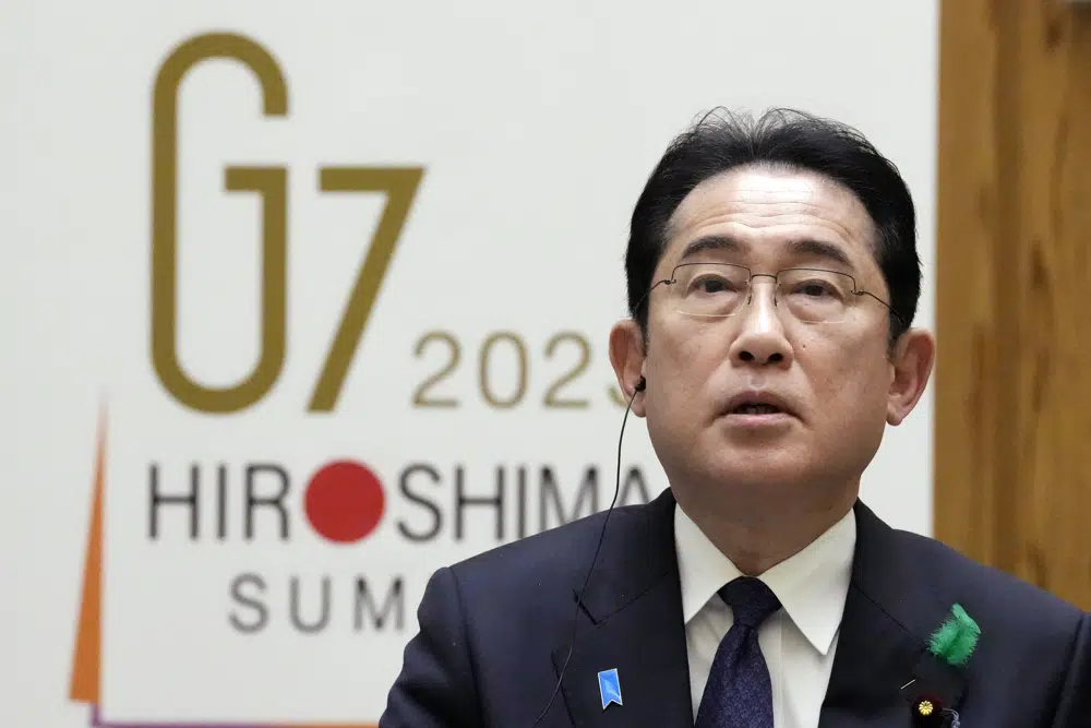 FILE - Japan's Prime Minister Fumio Kishida speaks during an interview with foreign media members at the Prime Minister's official residence Thursday, April 20, 2023, in Tokyo. Leaders of seven of the world’s most powerful democracies will gather this weekend for the Group of Seven summit in Hiroshima, the location of the world’s first atomic attack at the end of World War II. The leaders are expected to strongly condemn Russia’s war on Ukraine while pledging their continuing support for Ukraine. (AP Photo/Eugene Hoshiko, File)