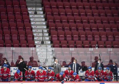 Playing in empty arena, Canadiens top Flyers 3-2 in shootout | AP News