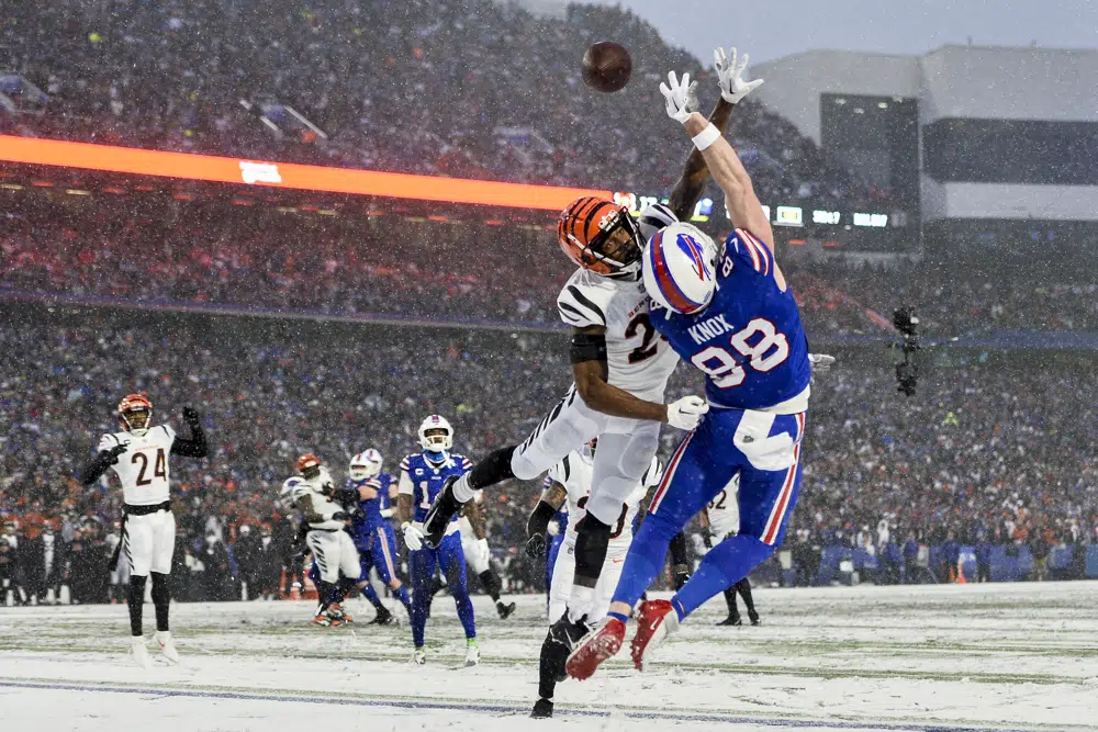 Cincinnati Bengals safety Dax Hill (23) breaks up a pass intended for Buffalo Bills tight end Dawson Knox (88) during the third quarter of an NFL division round football game, Sunday, Jan. 22, 2023, in Orchard Park, N.Y. (AP Photo/Adrian Kraus)