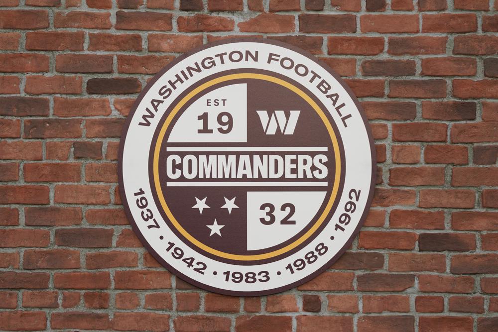 A Washington Commanders sign is shown as they unveil their NFL football team's new identity, Wednesday, Feb. 2, 2022, in Landover, Md. The new name comes 18 months after the once-storied franchise dropped its old moniker following decades of criticism that it was offensive to Native Americans. (AP Photo/Patrick Semansky)