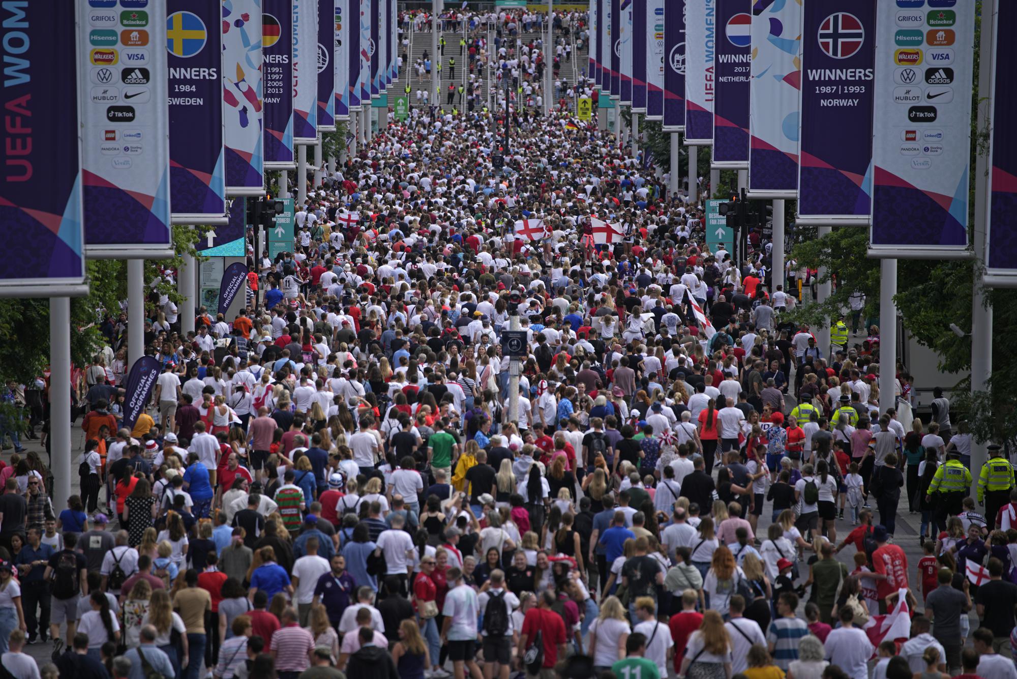 FILE - Supporters pack Wembley Way as they arrive for the final of the Women's Euro 2022 soccer match between England and Germany at Wembley stadium in London, Sunday, July 31, 2022. (AP Photo/Daniel Cole, File)