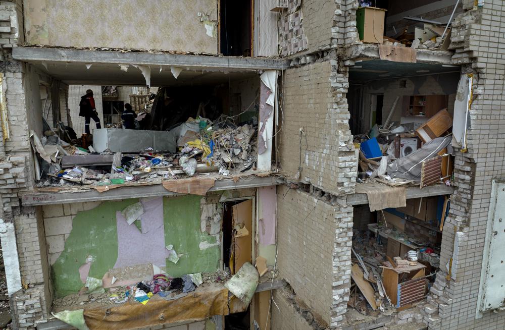 Firefighters work inside a building destroyed by a Russian bomb in Chernihiv on Friday, April 22, 2022. (AP Photo/Emilio Morenatti)