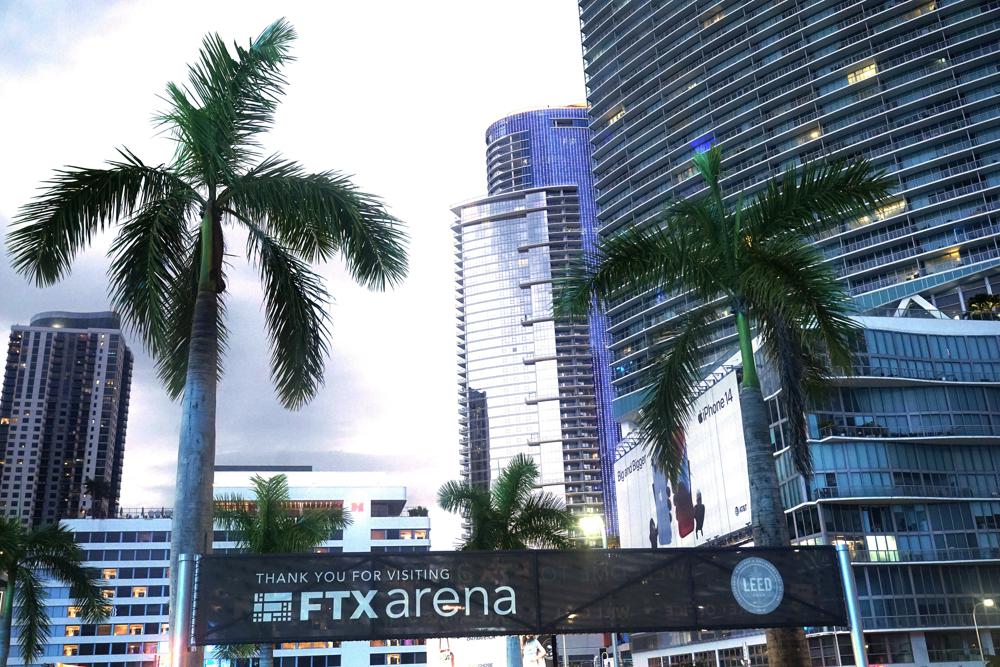 Signage for the FTX Arena, where the Miami Heat basketball team plays, is visible Saturday, Nov. 12, 2022, in Miami. Sam Bankman-Fried received numerous plaudits as he rapidly achieved superstar status as the head of cryptocurrency exchange FTX: the savior of crypto, the newest force in Democratic politics and potentially the world’s first trillionaire. Now the comments about the 30-year-old aren’t so kind after FTX filed for bankruptcy protection Friday, Nov. 11 leaving his investors and customers feeling duped and many others in the crypto world fearing the repercussions. (AP Photo/Marta Lavandier)