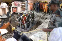 Rescuers work at the site of a structure built over an old temple well that collapsed Thursday as a large crowd of devotees gathered for the Ram Navami Hindu festival, in Indore, India, Friday, March 31, 2023. Thirty-five bodies have been found inside a well at a Hindu temple in central India after dozens of people fell into the muddy water when the well's cover collapsed. (AP Photo)
