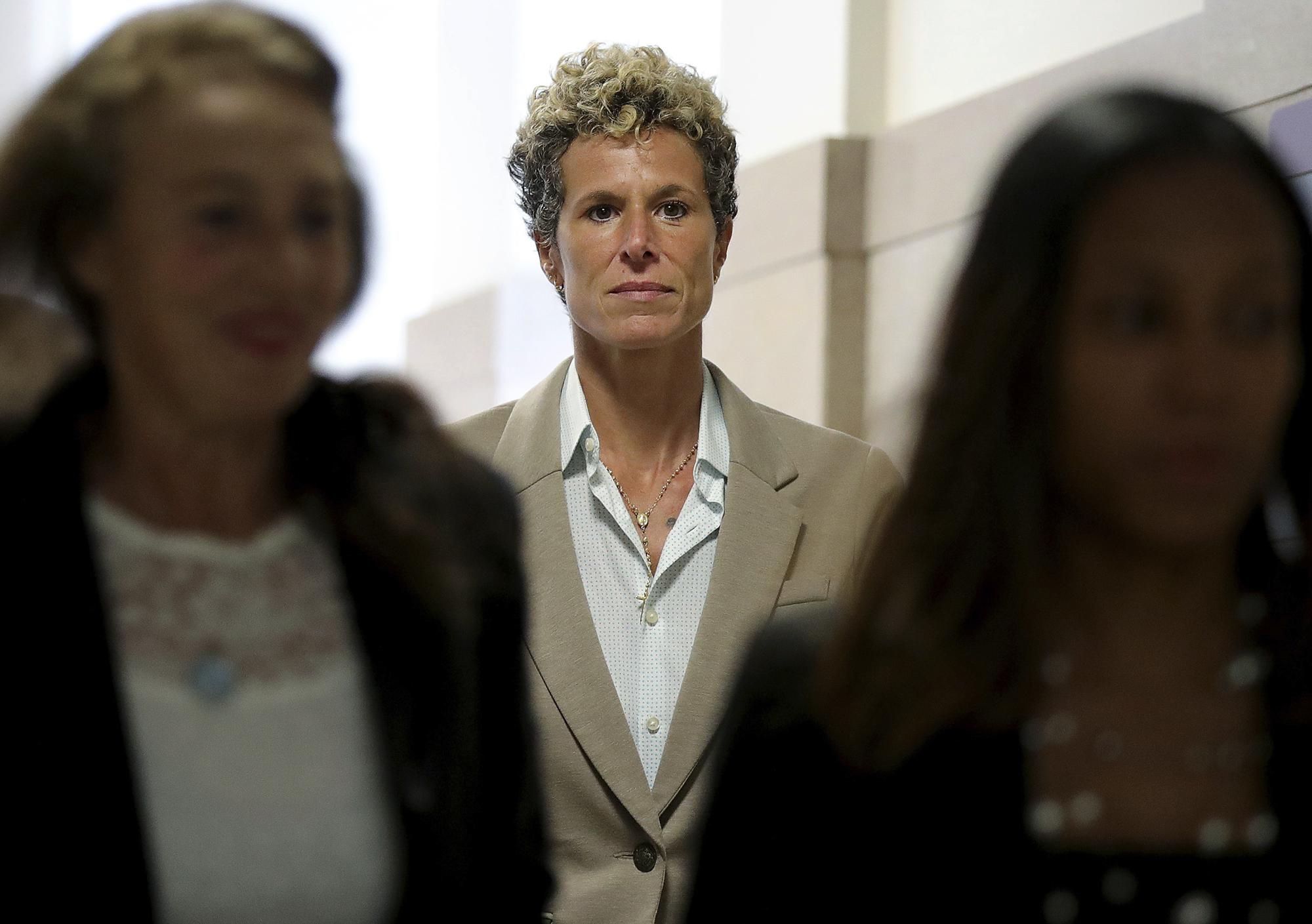 FILE - Andrea Constand returns to the courtroom during a lunch break at the sentencing hearing for Bill Cosby at the Montgomery County Courthouse in Norristown, Pa., on Sept. 24, 2018. The jury – deliberating as the #MeToo movement took hold – convicted the aging TV star of drugging and sexually assaulting her in 2005. The judge sent him to prison. Then a Pennsylvania appeals court found the prosecution case flawed and freed Cosby last year.  (David Maialetti/The Philadelphia Inquirer via AP, Pool, File)
