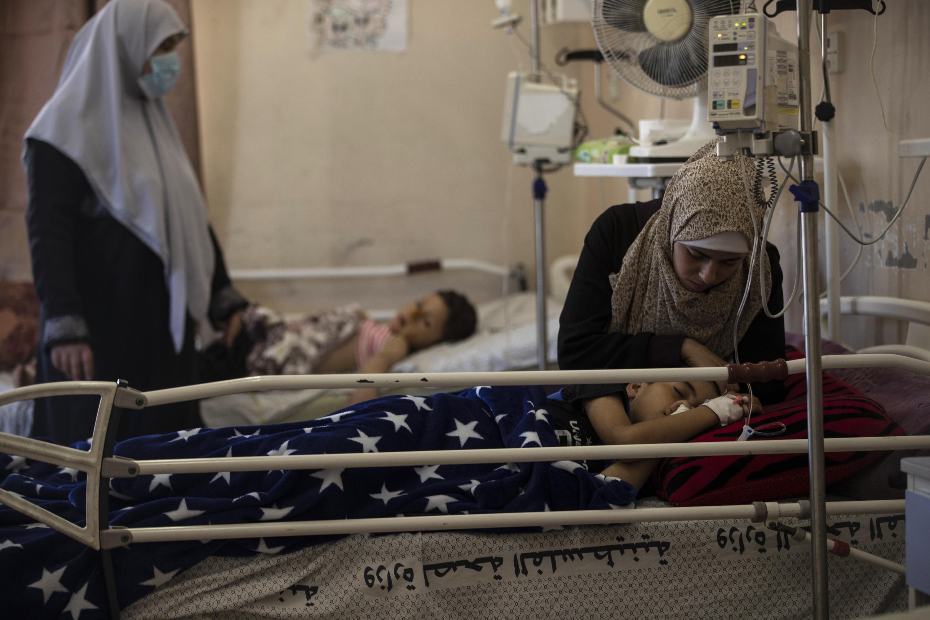 Beset by virus, Gaza's hospitals now struggle with wounded AP News