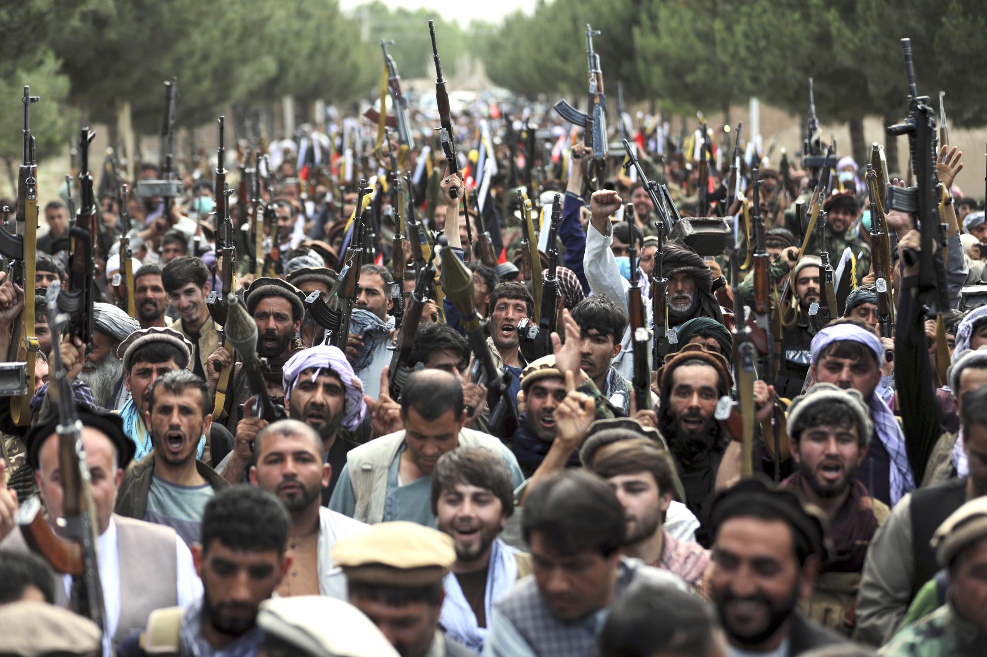 Afghan militiamen join Afghan defense and security forces during a gathering in Kabul, Afghanistan, Wednesday, June 23, 2021. (AP Photo/Rahmat Gul)