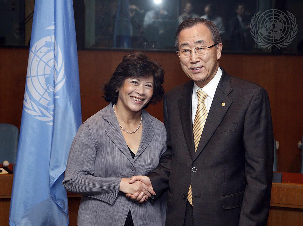 In this photo released by U.N. Photo, then U.S. Secretary-General Ban Ki-moon, right, poses with Noeleen Heyzer, then executive secretary of the Economic and Social Commission for Asia and the Pacific, for a photo after the two signed the 2009 Senior Management Compact Agreement, at U.N. headquarters on Feb. 12, 2009. Secretary-General Antonio Guterres on Monday, Oct. 25, 2021 announced the appointment of former U.N. undersecretary-general Heyzer of Singapore as the new U.N. special envoy for conflict-torn Myanmar. (U.N. Photo via AP)