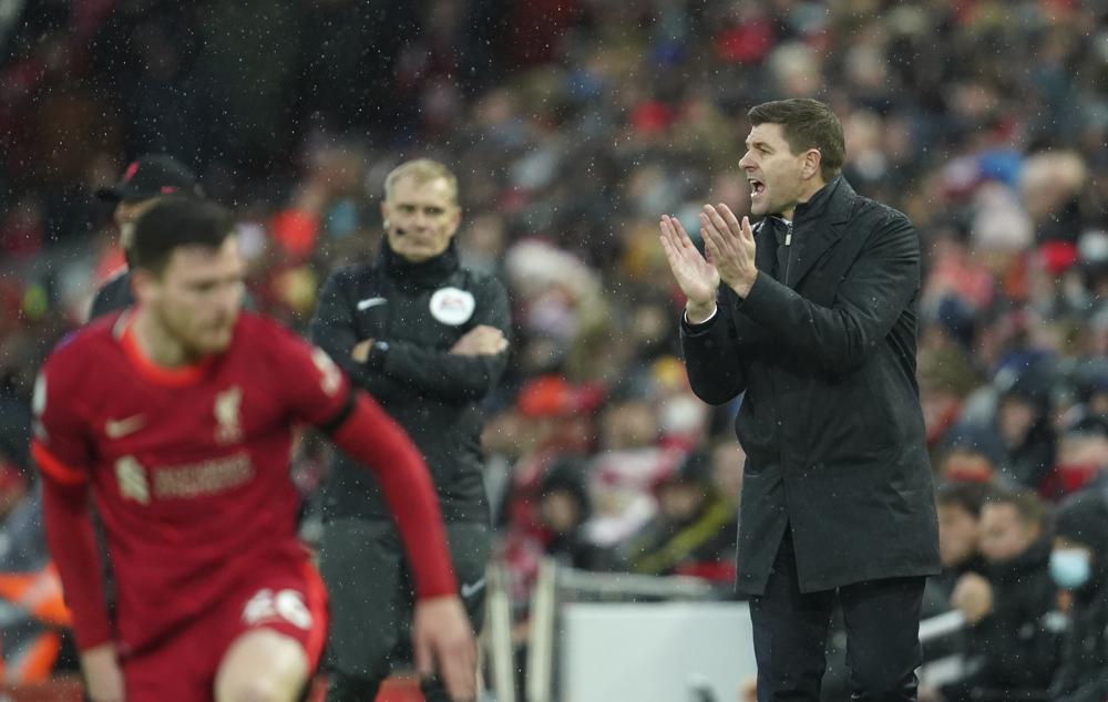 Aston Villa's head coach Steven Gerrard, right, reacts during the English Premier League soccer match between Liverpool and Aston Villa at Anfield stadium in Liverpool, Saturday, Dec. 11, 2021. (AP Photo/Jon Super)