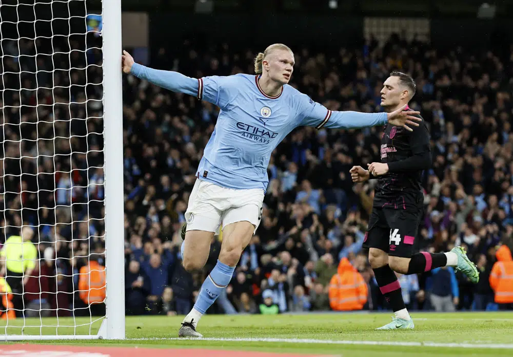 Manchester City's Erling Haaland celebrates scoring his side's first goal of the game during the FA Cup quarterfinal soccer match at the Etihad Stadium, Manchester, England, Saturday March 18, 2023. (Richard Sellers/PA via AP)
