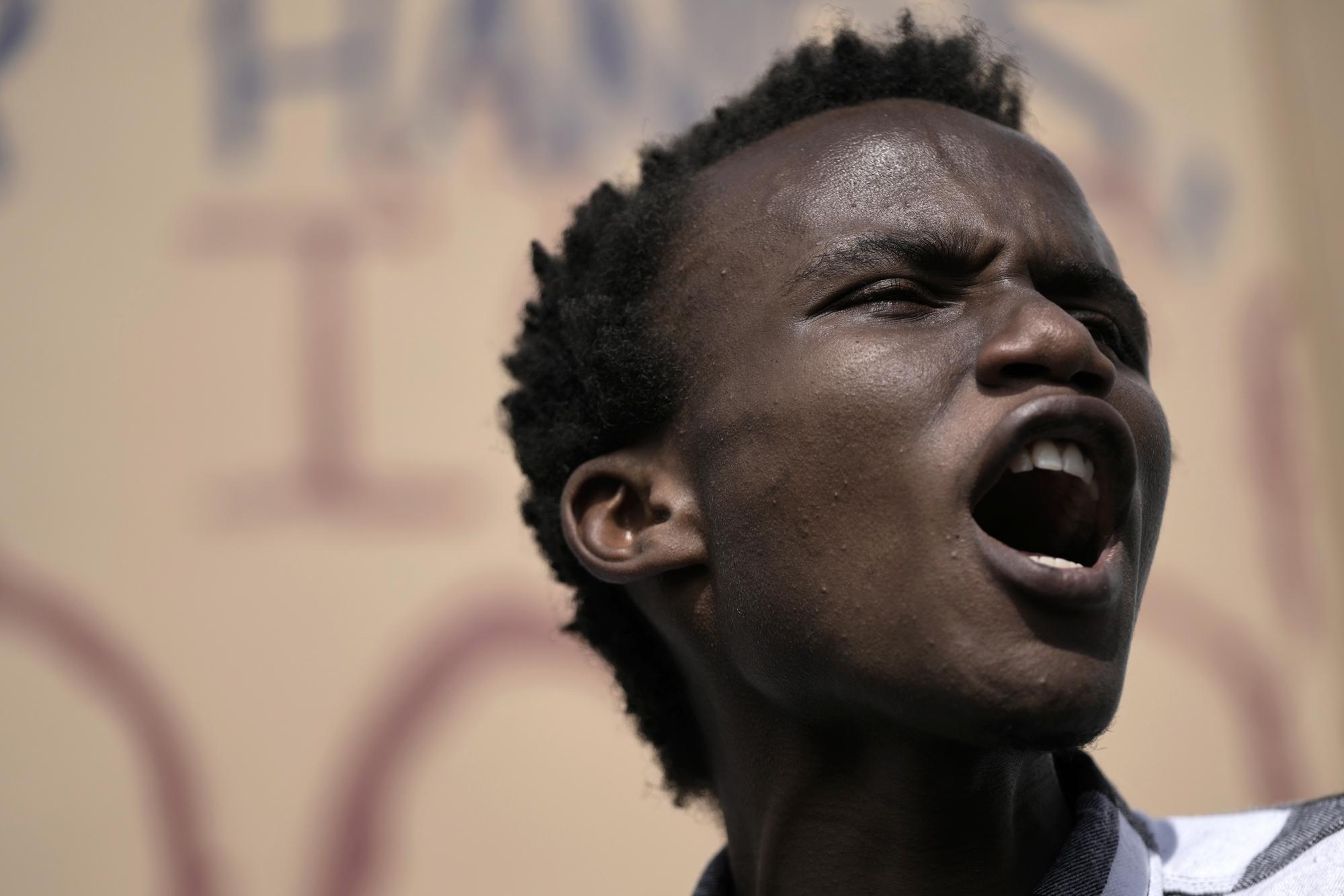 FILE - Youth climate activist Eric Njuguna, of Kenya, participates in a demonstration at the COP27 U.N. Climate Summit, Nov. 16, 2022, in Sharm el-Sheikh, Egypt. "I became a climate justice activist out of necessity," the 20-year-old says. "Having seen first-hand the impacts of the climate crisis, I joined the youth climate movement." (AP Photo/Nariman El-Mofty, File)