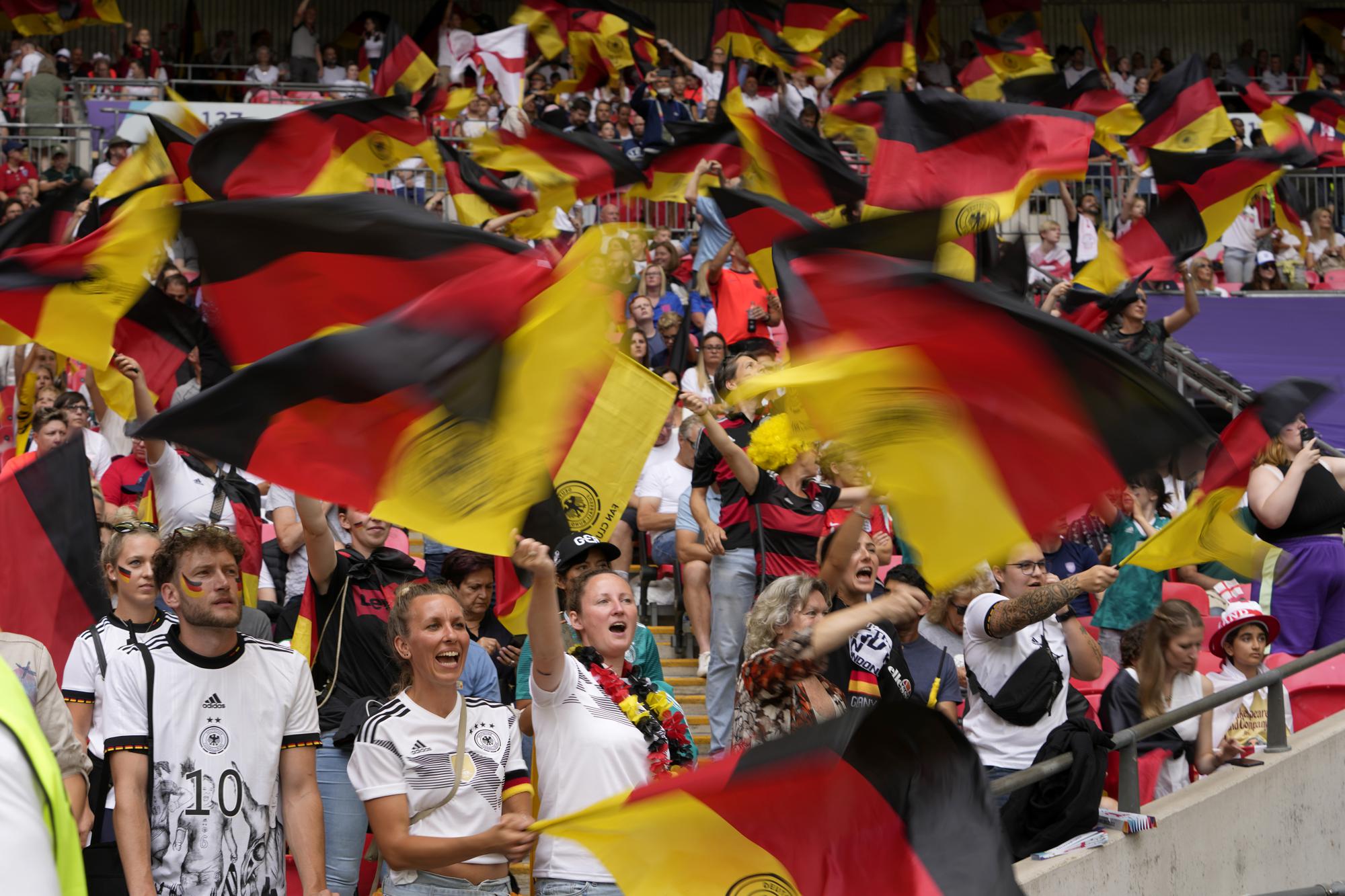 FILE - Germany supporters on the stands wave flags before the Women's Euro 2022 final soccer match between England and Germany at Wembley stadium in London, Sunday, July 31, 2022. (AP Photo/Alessandra Tarantino, File)