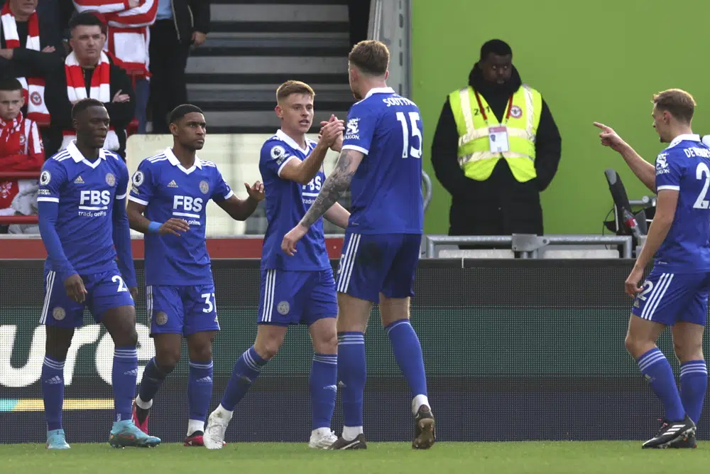 Leicester's Harvey Barnes, centre, celebrates after scoring his side's opening goal during the English Premier League soccer match between Brentford and Leicester City at Brentford Community Stadium in Brentford, West London, Saturday, March 18, 2023. (AP Photo/Ian Walton)