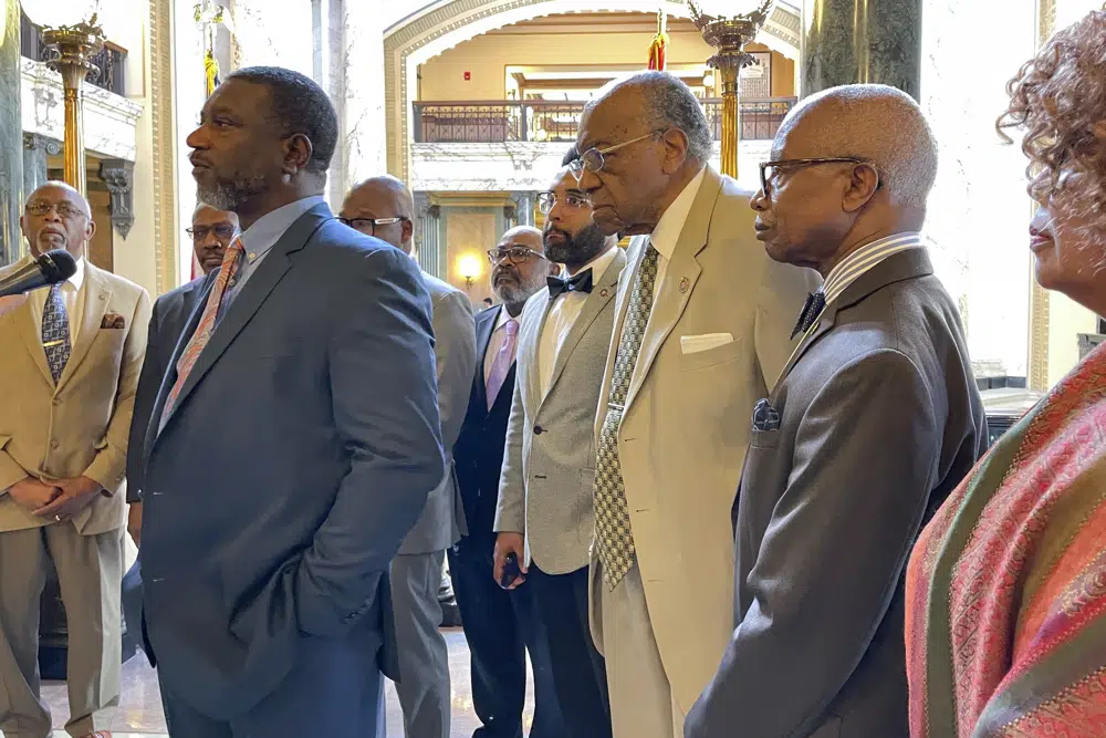 Mississippi state Sen. Juan Barnett, D-Heidelberg, left, speaks at a news conference Wednesday, March 29, 2023, at the state Capitol in Jackson, Miss., while surrounded by other members of the Legislative Black Caucus. Several caucus members denounced a vote by the Republican-led Senate to reject the nomination of Robert P. Taylor as Mississippi superintendent of education. Taylor would have been the second Black person to hold the job. (AP Photo/Emily Wagster Pettus)