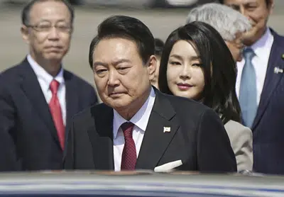 South Korean President Yoon Suk Yeol and his wife Kim Keon Hee arrive at Haneda International Airport in Tokyo, Thursday, March 16, 2023. Yoon and Japanese Prime Minister Fumio Kishida will seek to overcome disputes over history and quickly rebuild security and economic ties when they meet Thursday for the first summit in Japan between the two nations in more than a decade. (Yuya Shino/Kyodo News via AP)