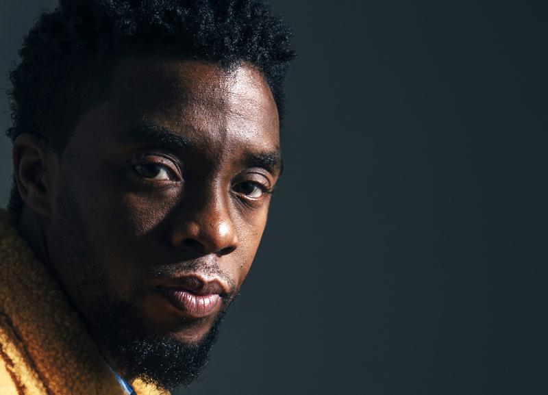 FILE - In this Feb. 14, 2018, file photo, actor Chadwick Boseman poses for a portrait in New York to promote his film, "Black Panther." The acclaimed actor is being posthumously honored as the namesake of Howard’s newly re-established Chadwick A. Boseman College of Fine Arts. Boseman, who graduated in 2000 with a BFA in directing, died in August 2020 at age 43 of colon cancer, after an illness that was largely kept secret. He rose to prominence playing a succession of Black icons in biographical films: Jackie Robinson, singer James Brown and Thurgood Marshall. (Photo by Victoria Will/Invision/AP)