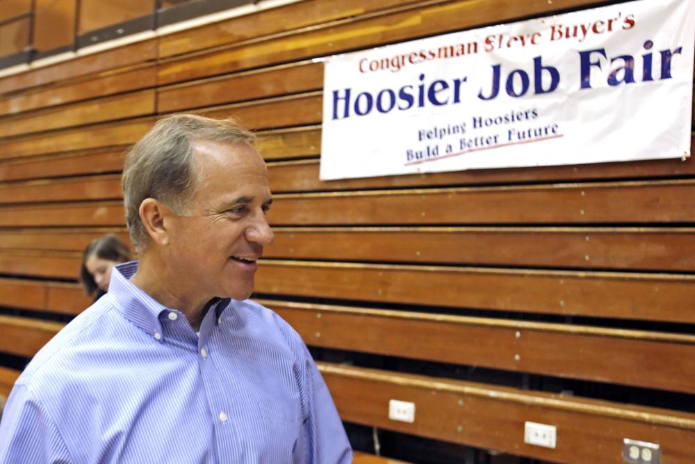 FILE — Indiana Congressman Stephen Buyer talks during a Hoosier Job Fair, July 19, 2010, at Jefferson High School in Lafayette, Ind. The former U.S. congressman from Indiana, technology company executives and an investment banker are among nine people charged in four separate and unrelated insider trading schemes. The charges were announced Monday, July 25, 2022 in Manhattan. (Michael Heinz/Journal & Courier via AP)
