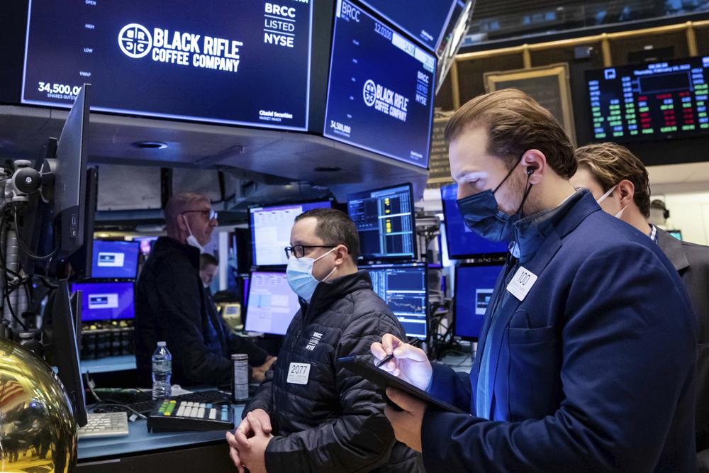In this photo provided by the New York Stock Exchange, traders work on the floor, Thursday, Feb 10, 2022. With inflation going only higher, stocks edged lower on Wall Street Thursday as expectations build that the Federal Reserve will have to get more aggressive about removing the tremendous support it's given the economy. (David L. Nemec/New York Stock Exchange via AP)