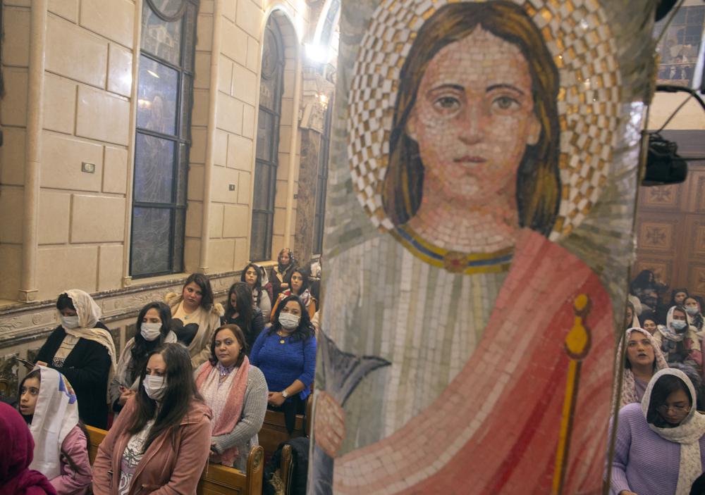 Egyptian Coptic Orthodox attend Midnight Liturgy on Orthodox Christmas Eve at Church of St. George in Cairo, Egypt, late Thursday, Jan. 6, 2022. Copts celebrate Christmas according to the Julian calendar, meaning it falls on Jan. 7. (AP Photo/Amr Nabil)