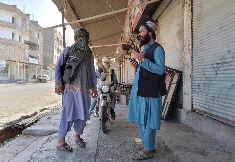 Taliban fighters patrol inside the city of Farah, capital of Farah province southwest of Kabul, Afghanistan, Wednesday, Aug. 11, 2021. (AP Photo/Mohammad Asif Khan)