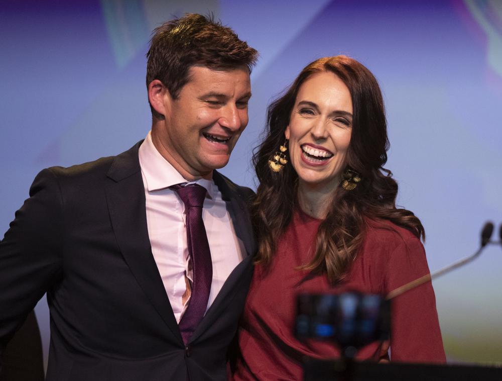 FILE - In this Oct. 17, 2020, file photo, New Zealand Prime Minister Jacinda Ardern, right, is congratulated by her partner Clarke Gayford following her victory speech to Labour Party members at an event in Auckland, New Zealand. Ardern plans to marry her longtime partner during the southern hemisphere summer. The couple announced their engagement two years ago. (AP Photo/Mark Baker, File)