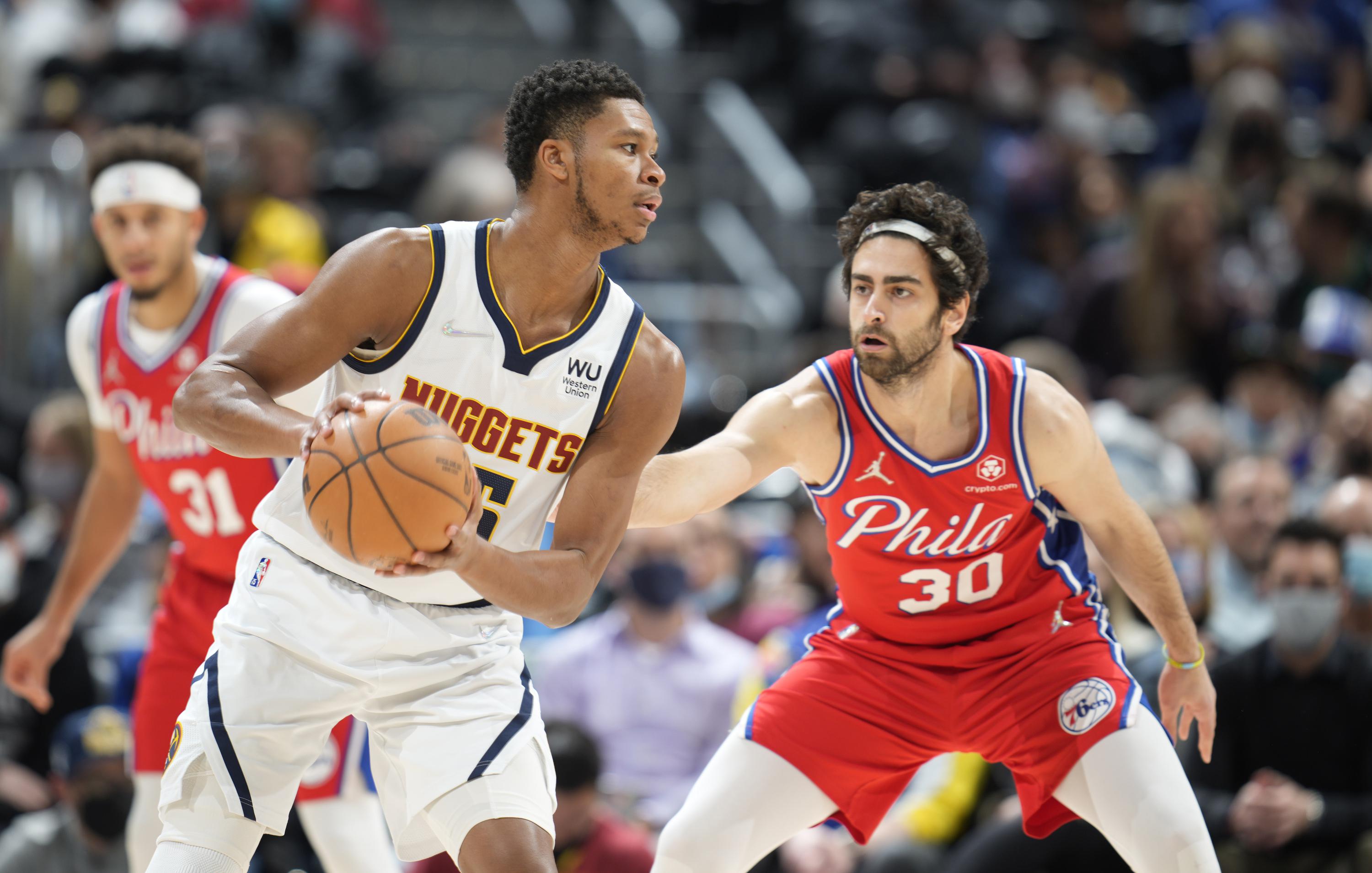 Nuggets say guard PJ Dozier out for season with torn ACL AP News