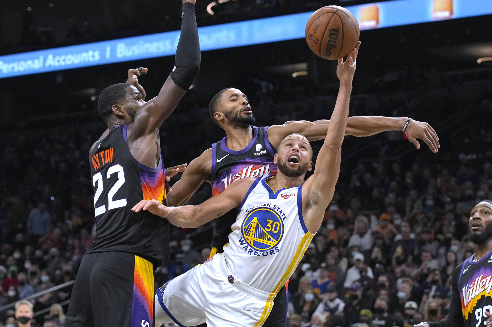 Warriors top Suns for NBA lead; Nets return to beat Lakers | AP News