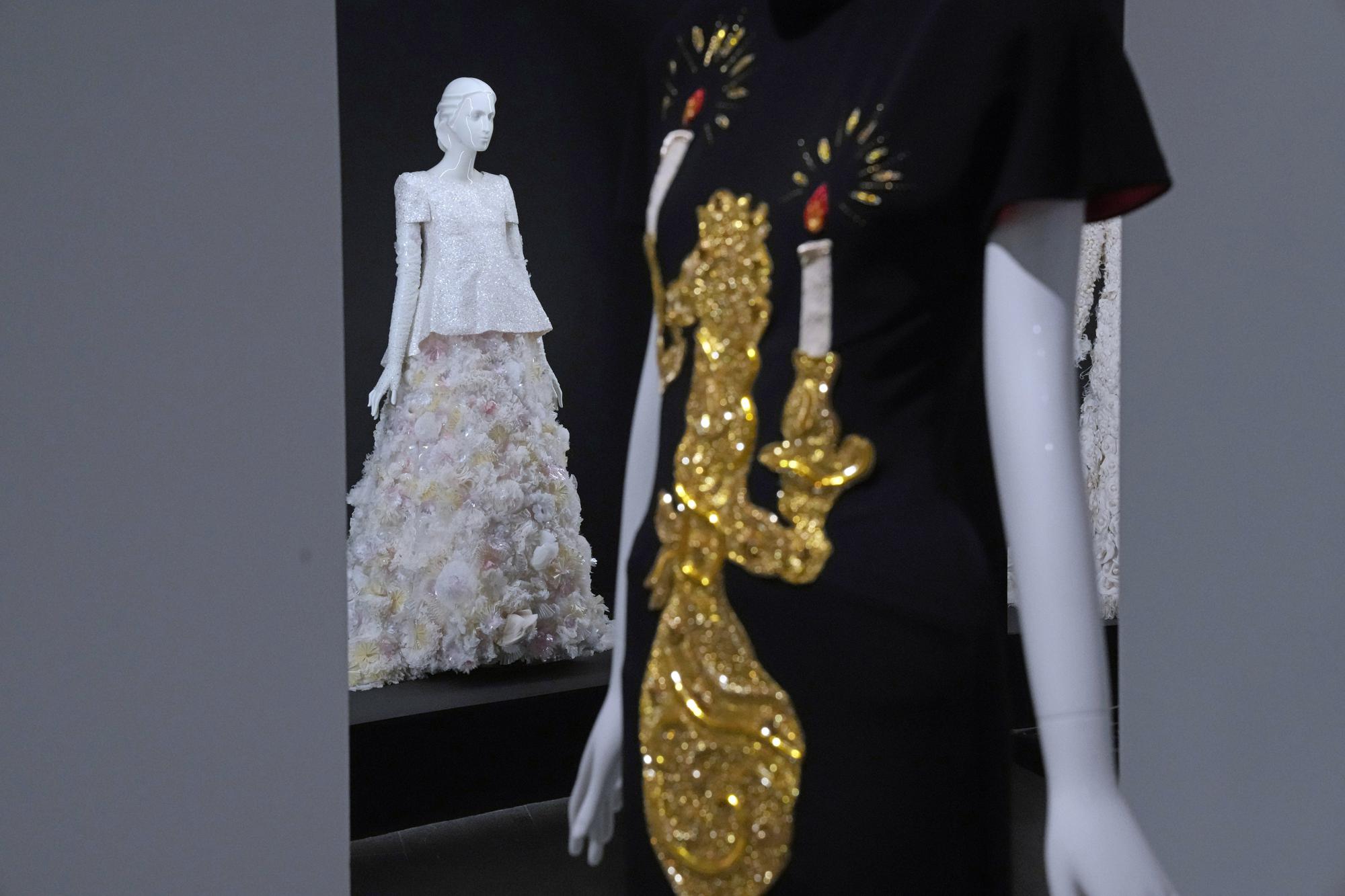 Designs by Karl Lagerfeld are displayed at the Metropolitan Museum of Art's Costume Institute exhibition, "Karl Lagerfeld: A Line of Beauty," on Saturday, April 29, 2023, in New York. (Photo by Charles Sykes/Invision/AP)