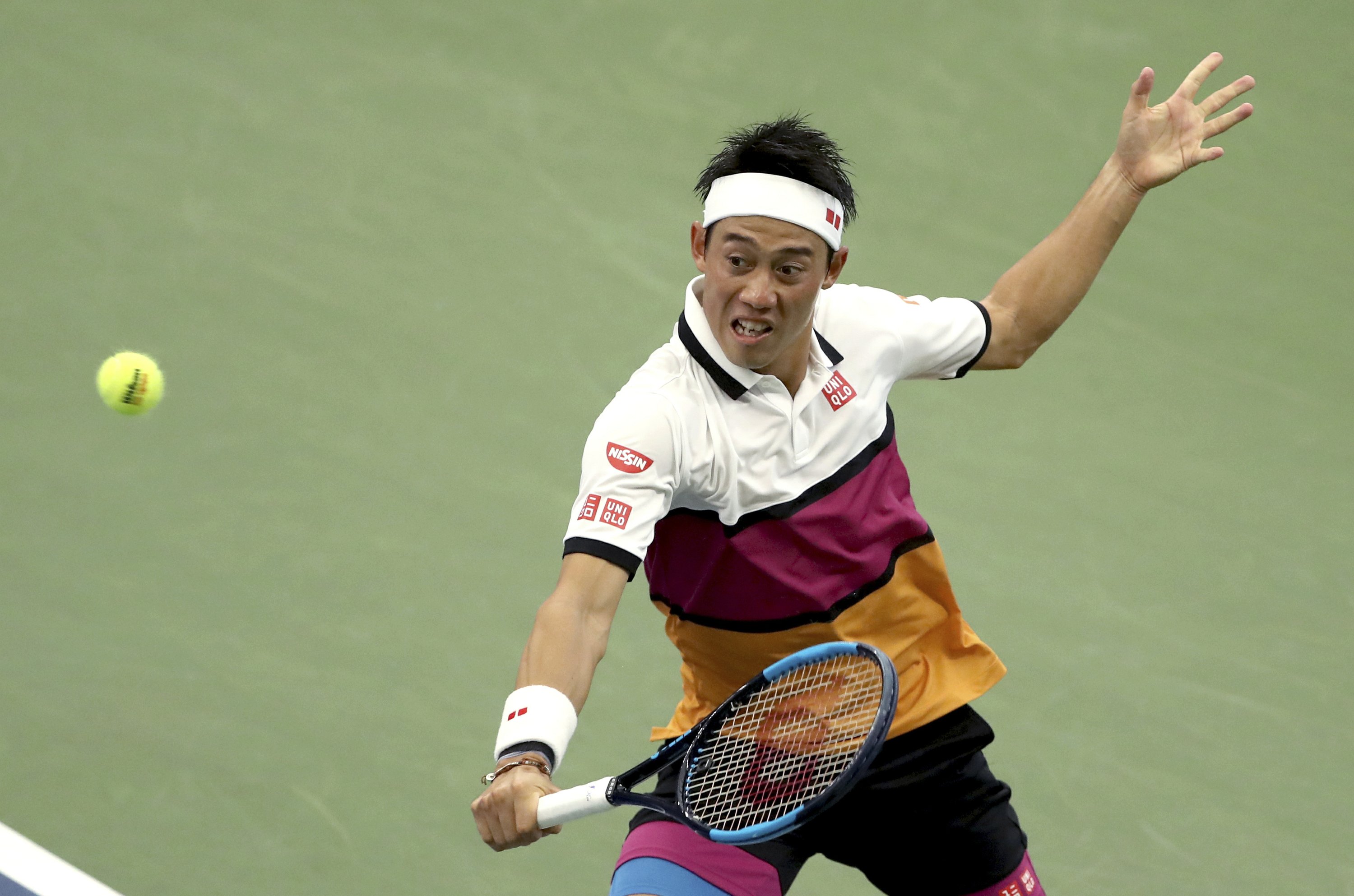 The Latest Nishikori holds on to advance at the US Open