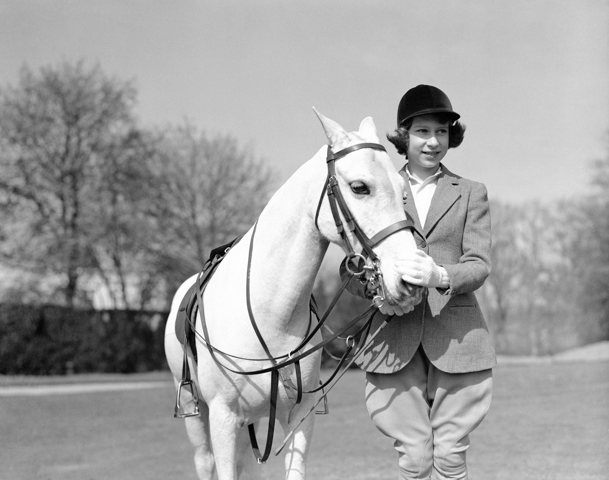 FILE - Princess Elizabeth the eldest daughter of King George VI and Queen Elizabeth, poses for a photo on her 13th birthday, in Windsor Great Park, in England, April 21, 1939. Queen Elizabeth II will mark 70 years on the throne Sunday, Feb. 6, 2022 an unprecedented reign that has made her a symbol of stability as the United Kingdom navigated an age of uncertainty. (AP Photo, File)