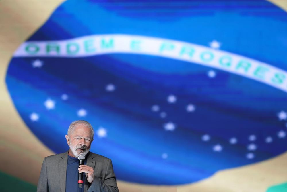 Brazil's former President Luiz Inacio Lula da Silva, who is running for reelection, speaks during a campaign rally in Brasilia, Brazil, Tuesday, July 12, 2022. Under tight security da Silva attended a political rally where he appealed to his backers to remain calm and avoid confrontations with adversaries.  (AP Photo/Eraldo Peres)