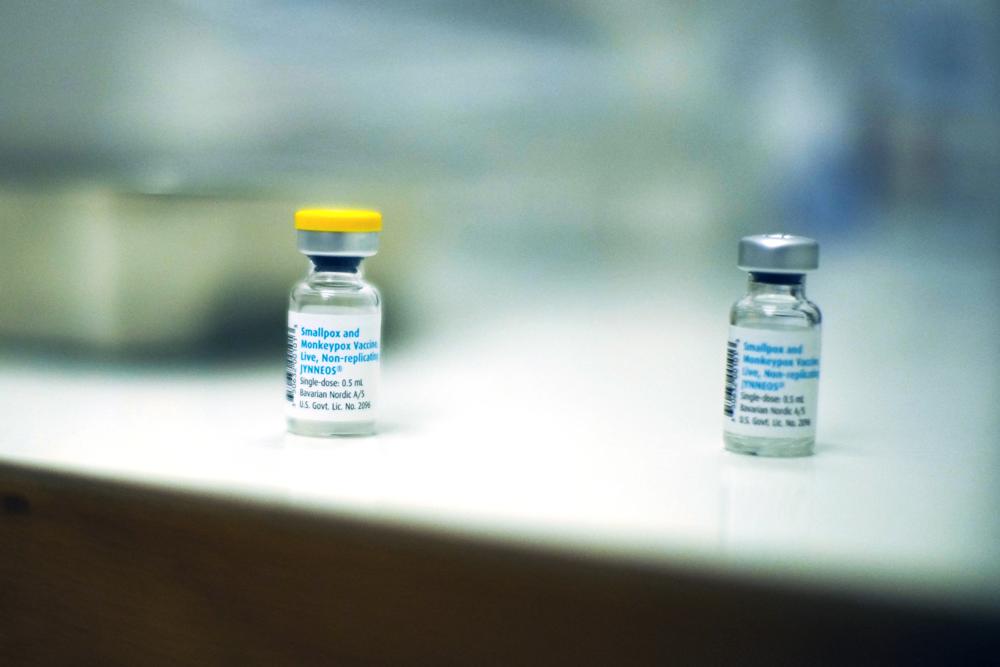 Empty vials of vaccines against Monkeypox lie on a table after being used to vaccinate people at a medical center in Barcelona, Spain, Tuesday, July 26, 2022. (AP Photo/Francisco Seco)