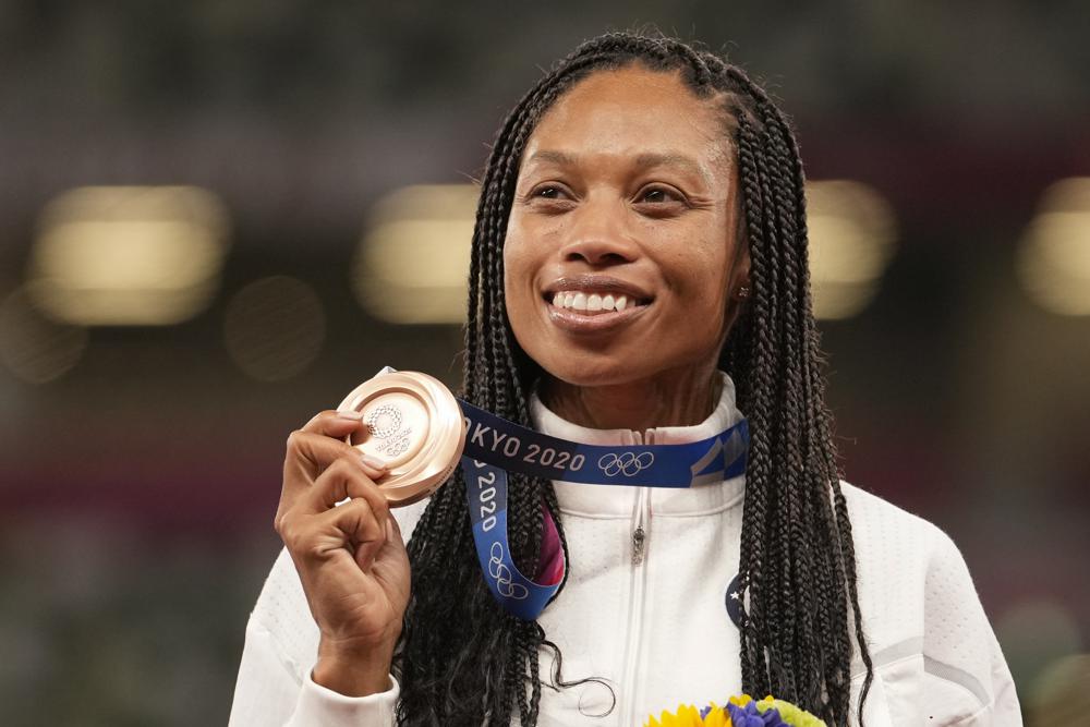 Bronze medalist Allyson Felix, of the United States, poses during the medal ceremony for the women's 400-meter run at the 2020 Summer Olympics, Friday, Aug. 6, 2021, in Tokyo. (AP Photo/Martin Meissner)