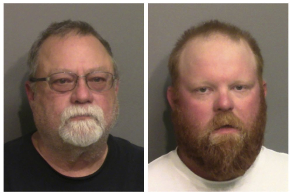 This photo combo of images taken Thursday, May 7, 2020, and provided by the Glynn County Detention Center, in Georgia, show Gregory McMichael, left, and his son Travis McMichael. A prosecutor on Wednesday, June 24, 2020 announced that three men have been indicted on murder charges in the killing of Ahmaud Arbery in coastal Georgia. Speaking to reporters outside the Glynn County courthouse, prosecutor Joyette Holmes said a grand jury has indicted Travis McMichael, Gregory McMichael and William “Roddie” Bryan Jr. on charges including malice and felony murder in the death of the African American man. (Glynn County Detention Center via AP)