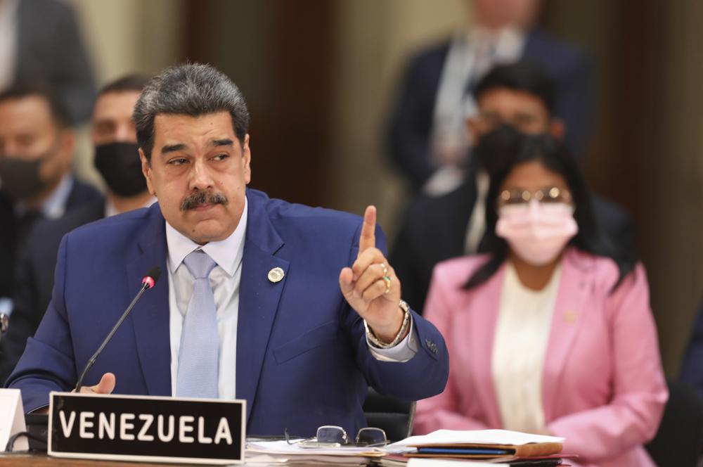 In this handout photo provided by the Miraflores Press Office, Venezuela's President Nicolas Maduro speaks at the Community of Latin American and Caribbean States, or CELAC summit, in Mexico City, Saturday, Sept. 18, 2021. (Miraflores Press Office via AP)