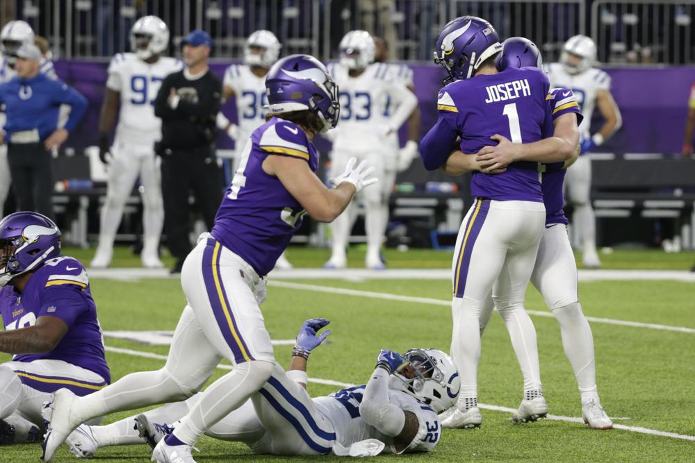 Minnesota Vikings place kicker Greg Joseph (1) celebrates with teammates after kicking a 40-yard field goal during overtime in an NFL football game against the Indianapolis Colts, Saturday, Dec. 17, 2022, in Minneapolis. The Vikings won 39-36. (AP Photo/Andy Clayton-King)