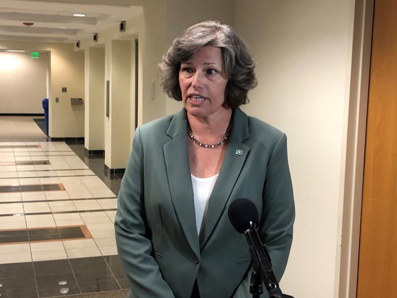 Dionne Delli-Gatti, secretary of the North Carolina Department of Environmental Quality, speaks to reporters at the Legislative Office Building, on Wednesday, June 2, 2021, in Raleigh, N.C. A state Senate committee recommended Wednesday that Delli-Gatti not be confirmed for the secretary's position. Gov. Roy Cooper picked her for the job. (AP Photo/Gary D. Robertson)