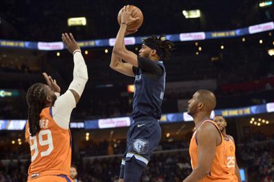Short-handed Grizzlies snap Suns' nine 