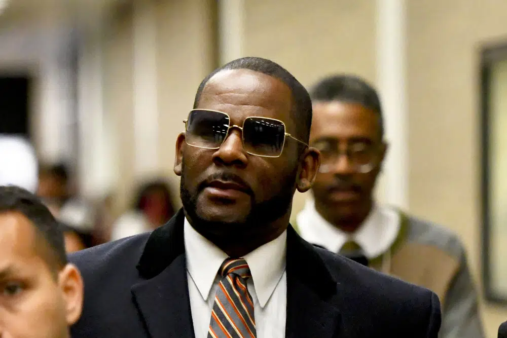  Musician R. Kelly, center, leaves the Daley Center after a hearing in his child support case on May 8, 2019, in Chicago.