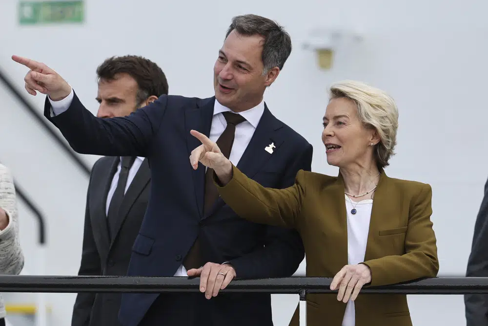 Belgium's Prime Minister Alexander De Croo, centre, and European Commission President Ursula von der Leyen gesture during the North Sea Summit in Ostend, Belgium, Monday, April 24, 2023. Leaders gather on Monday in the hopes of expanding a collective ambition to harness the full energy and industrial potential of the North Sea and make it the largest powerhouse of Europe by 2050. (AP Photo/Geert Vanden Wijngaert)