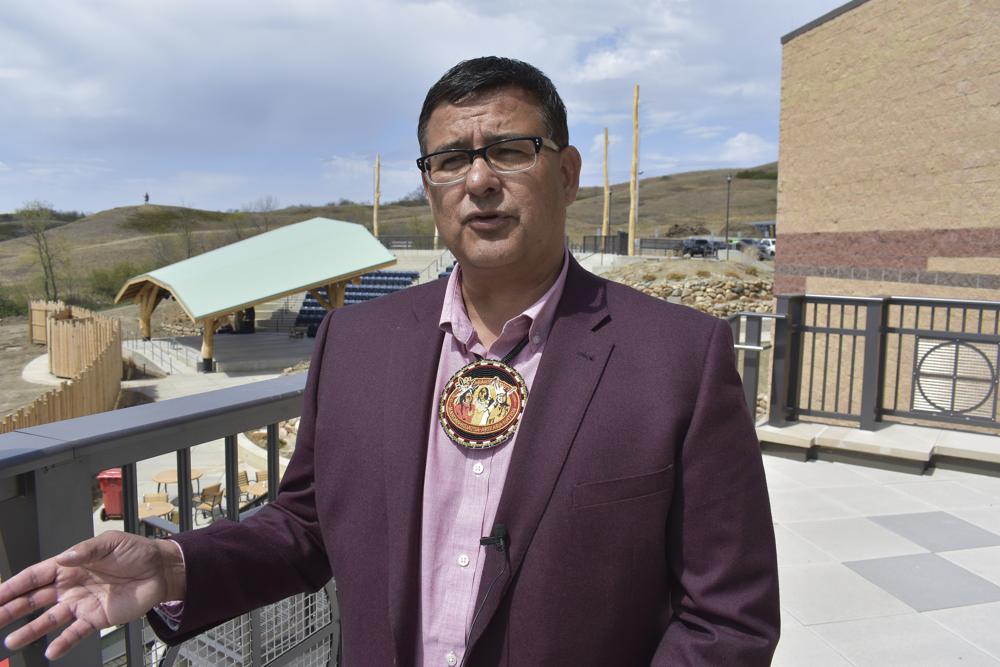 In this Wednesday, May 19, 2021, photo, Mark Fox, chairman of the MHA Nation, speaks during the opening of the MHA Nation Interpretive Center on the Fort Berthold Indian Reservation in New Town, North Dakota. "We're one of the few tribes that have elected to develop our energy resources. That's our right," tribal Chairman Mark Fox told AP at the opening of a museum and cultural center built with oil revenue. "We can develop those resources and do it responsibly so our children and grandchildren for the next 100 years have somewhere to live." (AP Photo/Matthew Brown)