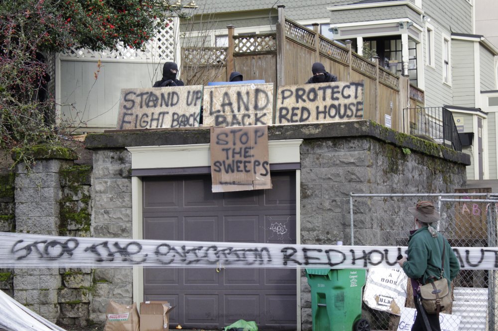 Portland police chief asks activists to leave barricaded house