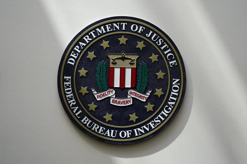 FILE - An FBI seal is seen on a wall on Aug. 10, 2022, in Omaha, Neb. Hate crimes in the U.S. remained relatively high last year after a surge not seen in nearly two decades, according to a new FBI report Monday, Dec. 12. But experts say is actually an undercount because thousands of police departments, including some of the country’s largest, didn’t report their data. (AP Photo/Charlie Neibergall, File)