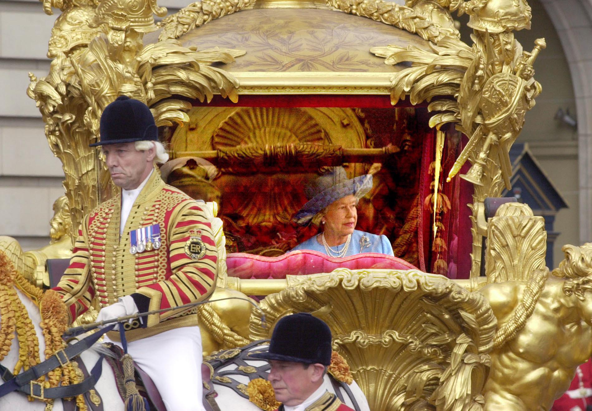 FILE - Britain's Queen Elizabeth II and her husband Prince Philip, ride in the State Gold Coach enroute to St. Paul's Cathedral in London, June 4, 2022 for a service of thanksgiving to mark her Golden Jubilee. Queen Elizabeth II, Britain’s longest-reigning monarch and a rock of stability across much of a turbulent century, has died. She was 96. Buckingham Palace made the announcement in a statement on Thursday Sept. 8, 2022 (AP Photo/Dave Caulkin/Pool, File)