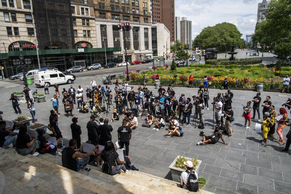 People attend a rally with Terrence Floyd, brother of George Floyd, on Sunday, May 23, 2021, in Brooklyn borough of New York. George Floyd, whose May 25, 2020 death in Minneapolis was captured on video, plead for air as he was pinned under the knee of former officer Derek Chauvin, who was convicted of murder and manslaughter in April 2021. (AP Photo/Eduardo Munoz Alvarez)